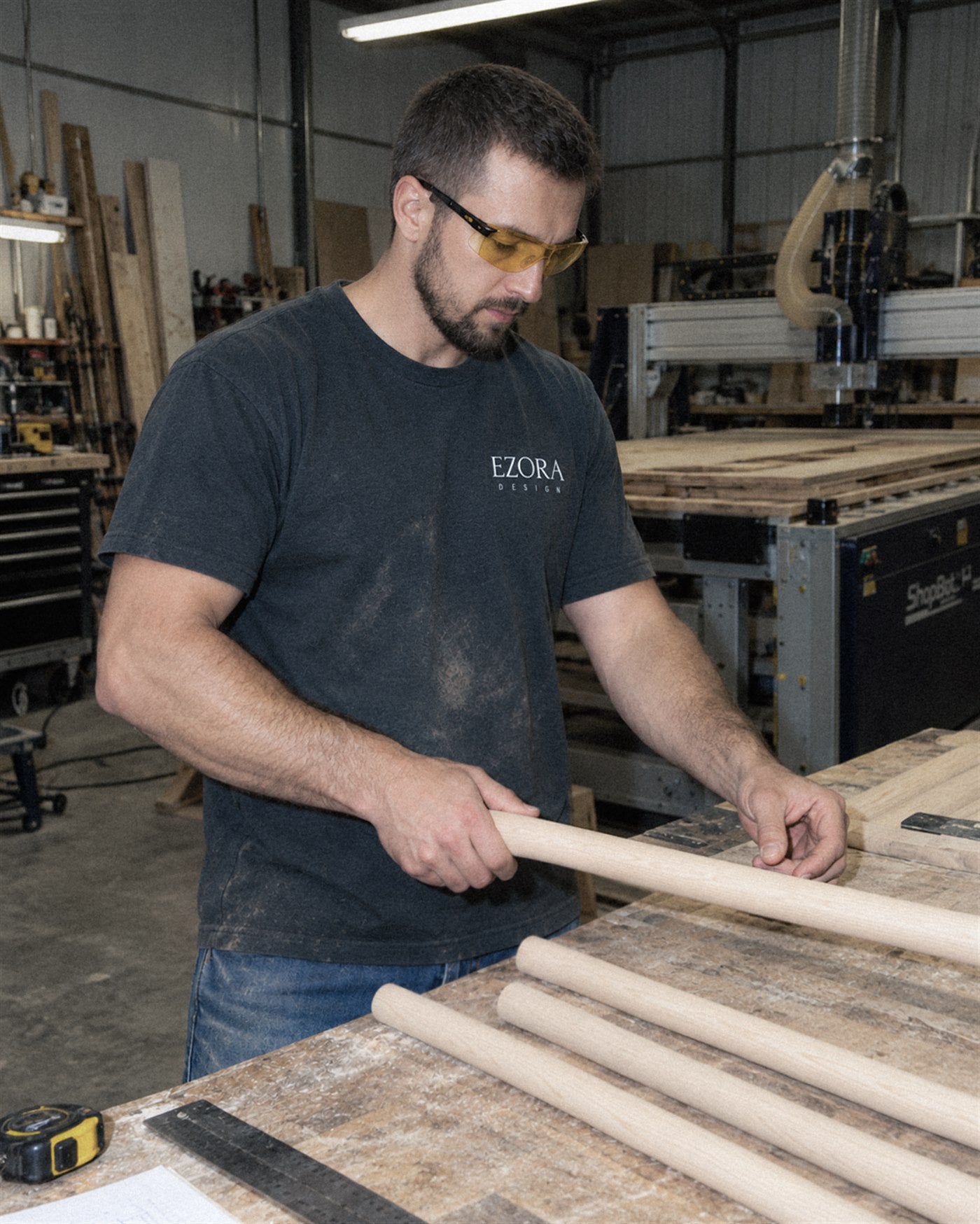 A member of the EZORA Design workshop sanding a birch rung