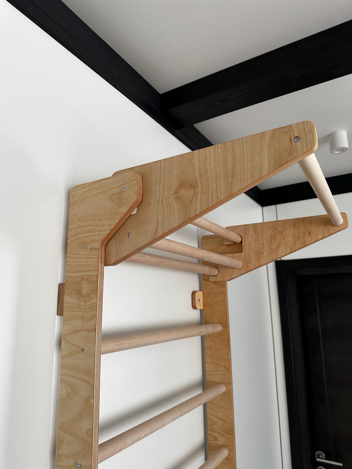 Close-up of a wall bar mounting bracket and fixing
